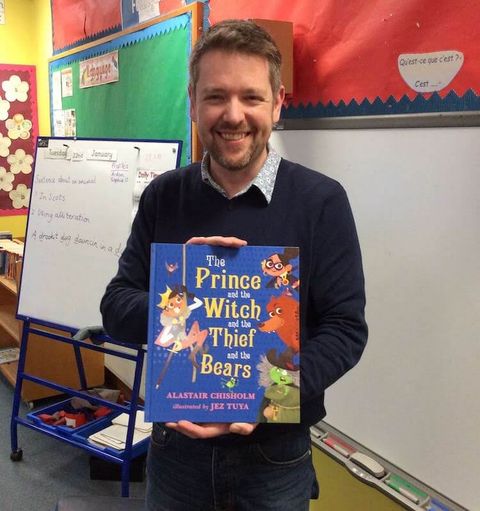 Alastair Chisholm holding a picturebook
