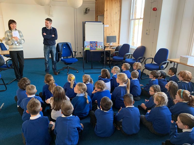 Photo of Alastair, librarian and children at Galashiels library