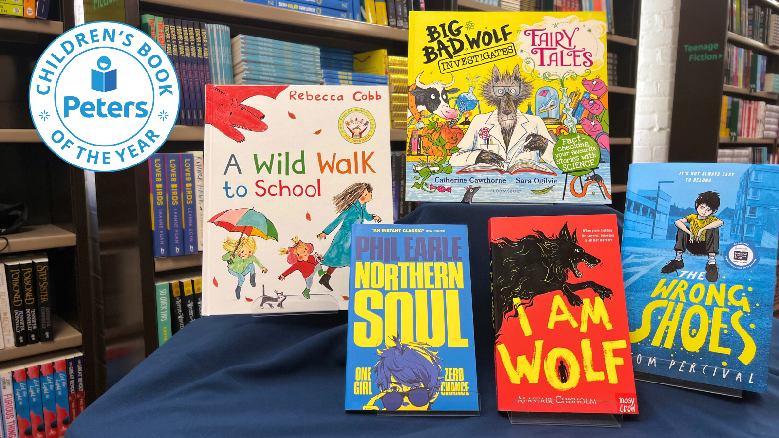 All the winners of the Peters Children's Book Awards. Clockwise from left: A Wild Walk to School by Rebecca Cobb, Big Bad Wolf Investigates by Catherine Cawthorne and Sara Ogilvie, The Wrong Shoes by Tom Percival, I Am Wolf by Alastair Chisholm, and Nortern Soul by Phil Earle.