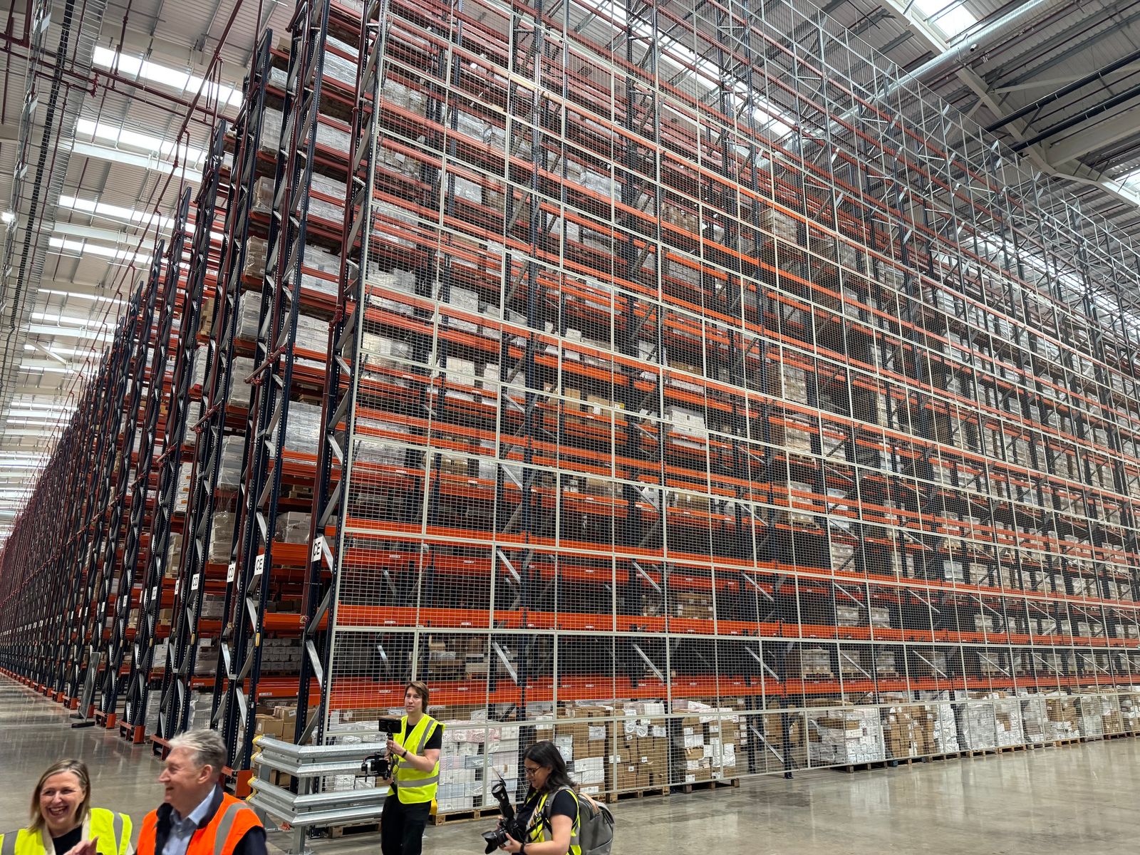 An enormous warehouse containing stacks of shelves.