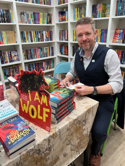 Alastair Chisholm signing copies of his book