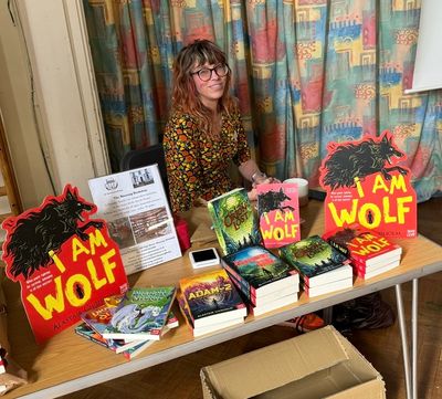 Bookseller Godrun of Steyning Books with a display for I Am Wolf