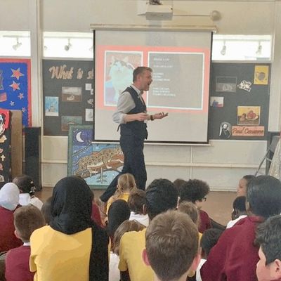 Alastair Chisholm giving a presentation to a school audience