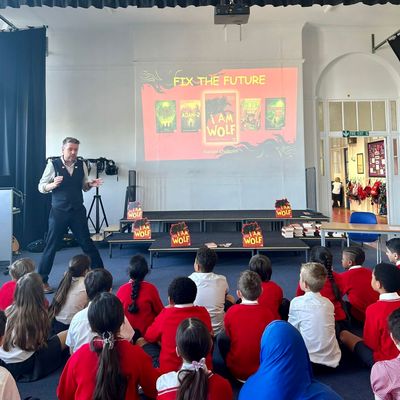 Alastair Chisholm presenting an event about his book I AM WOLF to primary school pupils